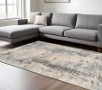 9' X 13' Ivory Blue Machine Woven Abstract Indoor Area Rug