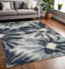 5' X 8' Ivory Blue Machine Woven Floral Indoor Area Rug