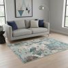 5' X 8' Ivory Teal Machine Woven Abstract Indoor Area Rug