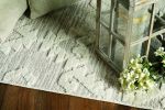 5' X 8' Beige and Ivory Geometric Area Rug
