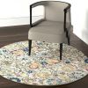 4' Orange And Ivory Round Floral Power Loom Area Rug