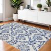 4' X 6' Blue And Ivory Floral Dhurrie Area Rug