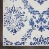 5' X 7' Blue And Ivory Floral Dhurrie Area Rug