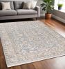 5' X 8' Blue Ivory Machine Woven Floral Oriental Indoor Area Rug