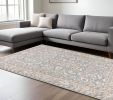 6' X 9' Blue Ivory Machine Woven Floral Oriental Indoor Area Rug