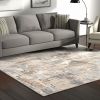 5' X 8' Beige And Ivory Abstract Area Rug